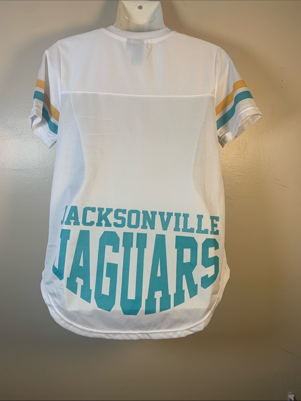 Jacksonville Jaguars Women’s ' White & Teal Team Graphic Tee flawed misspelling